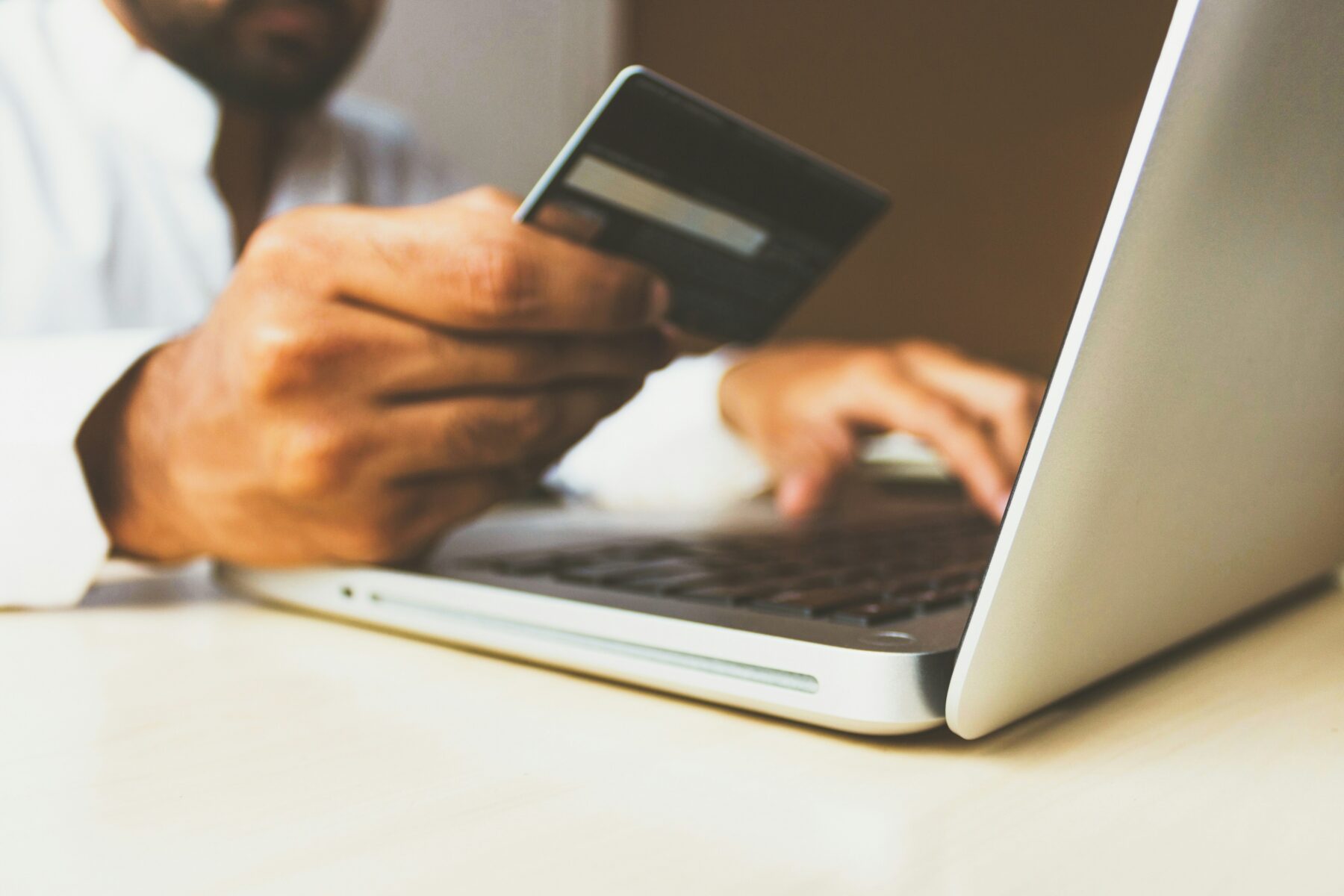 Man making credit card payment on computer