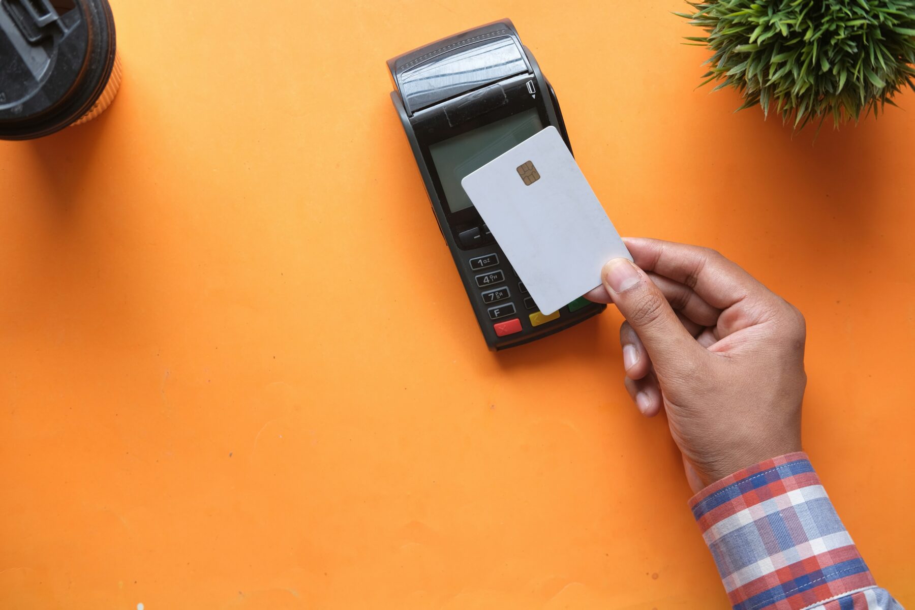 Man making credit card payment on machine